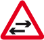 Two-way traffic crosses one-way road